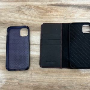 Three iPhone cases, the two dark ones for 11 and the pink for iPhone 13.